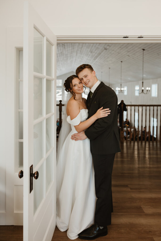 Bride and groom smiling with faces close together during couple portraits at Grand Ivory