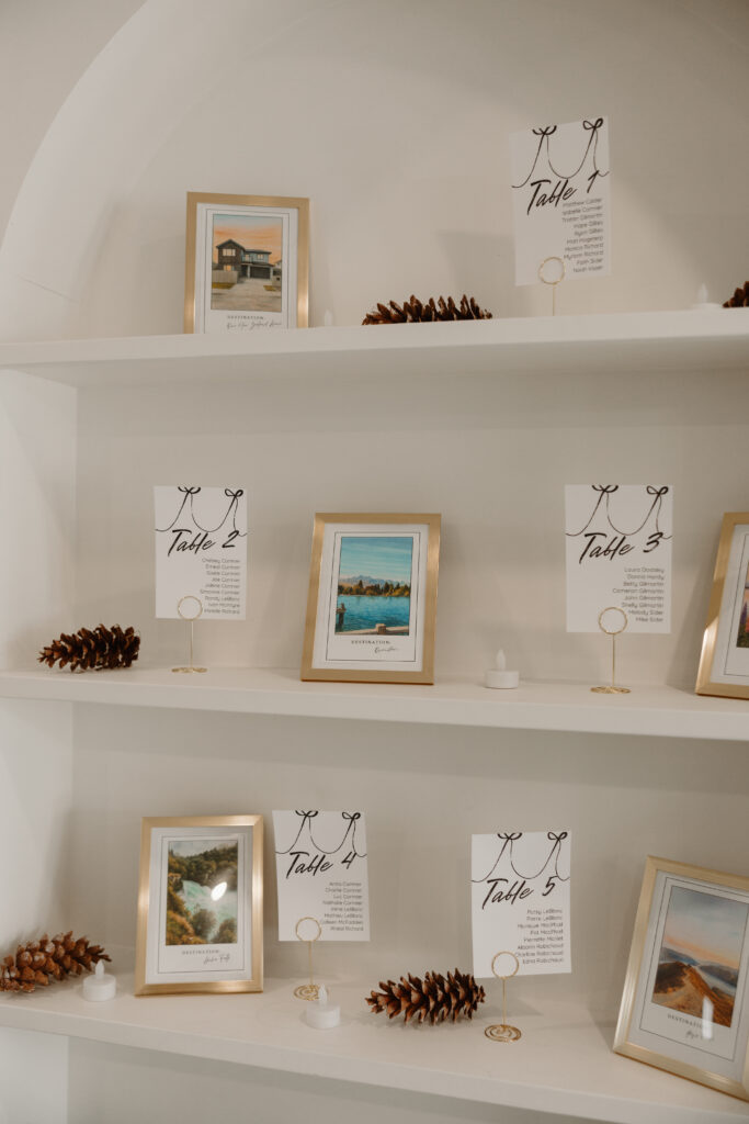 Personalized wedding entrance decor at Grand Ivory featuring arches filled with couple’s pictures, pinecones, and candles