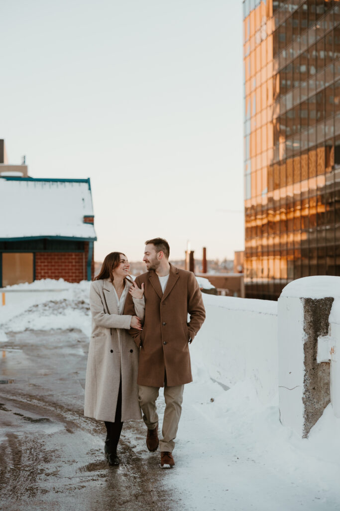 couple walking arm in arm in parking garage