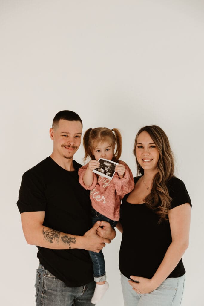 Little girl in Big Sister sweater studio pregnancy announcement Moncton NB