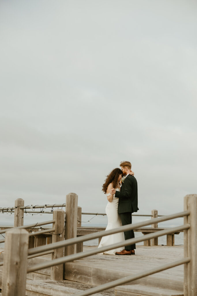 bride and groom first dance near the ocean in Shediac New Brunswick