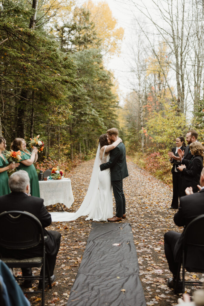 First kiss shared by couple during their fall wedding at irishtown nature park