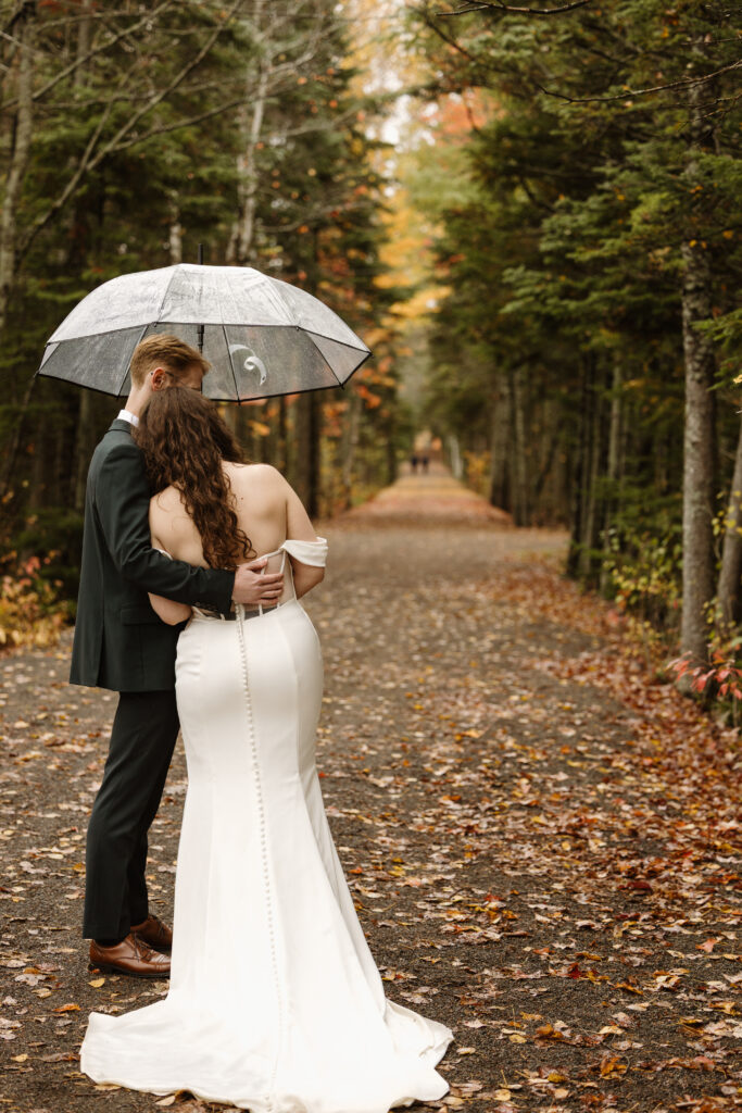 bride and groom having a quiet moment together in the trail of Irishtown park