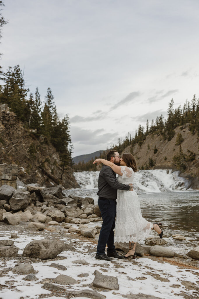 Engagement pictures in front of Bow Falls Banff Alberta