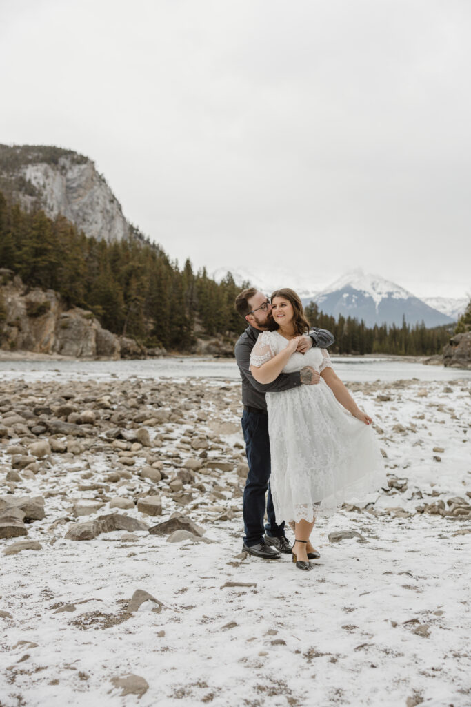 Engagement pictures in front of Bow Falls Banff Alberta