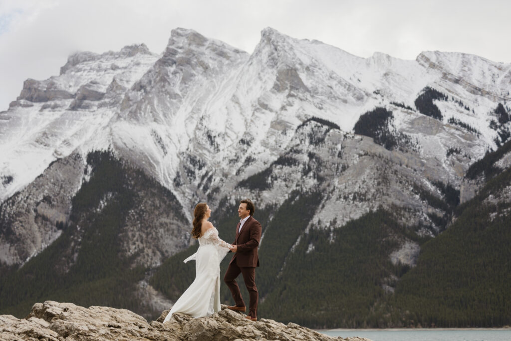 Lake Minnewanka elopement exchanging vows
