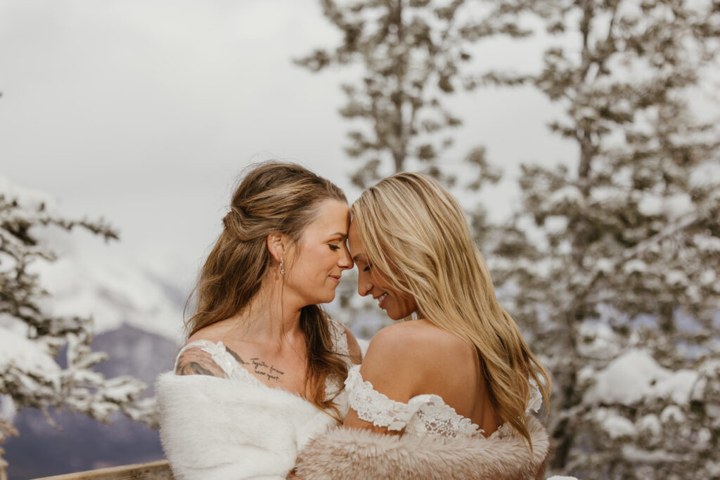 Brides close together during Summit Ridge
elopement