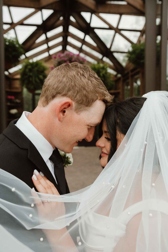 Bride and groom outside cedar glass pavilion wedding venue Moncton NB