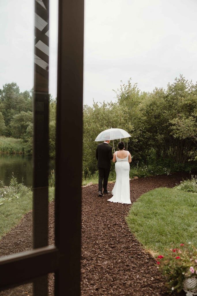 Couple beside private pond at The Pavilion Moncton summer wedding